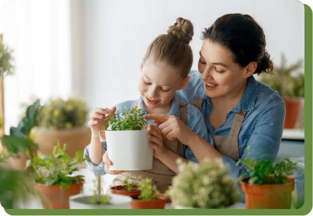Parent looking at plant with child